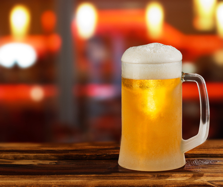 cold light beer glass mug in a pubの写真素材