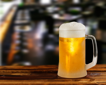 cold light beer glass mug in a pubの写真素材