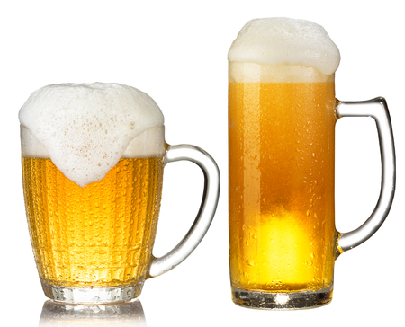 cold mug of beer with foam isolated on white backgroundの写真素材