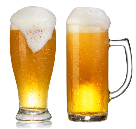 cold mug of beer with foam isolated on white backgroundの写真素材