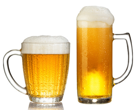 cold mug of beer with foam isolated on white backgroundの写真素材