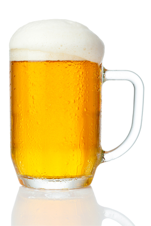cold mug of beer with foam isolated on white backgroundの写真素材