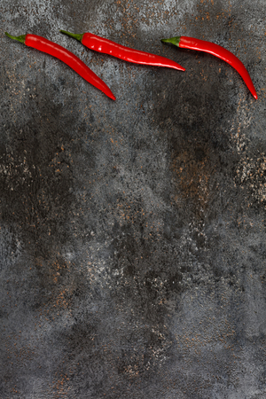 Red hot chili pepper on grunge background.Top view, flat lay design.の写真素材