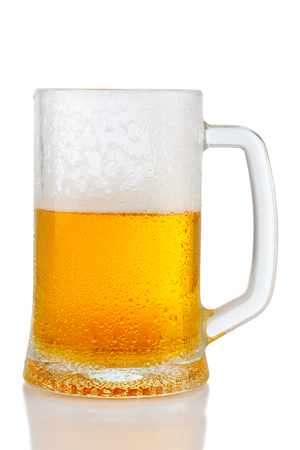 cold mug of beer with foam isolated on white backgroundの写真素材