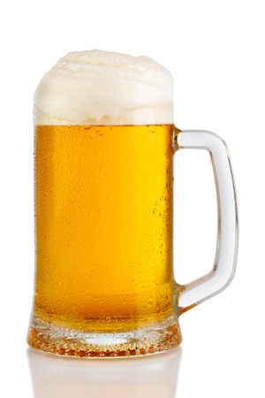 cold mug of beer with foam isolated on white backgroundの写真素材