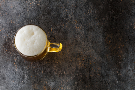 mug with beer on a vintage backgroundの写真素材