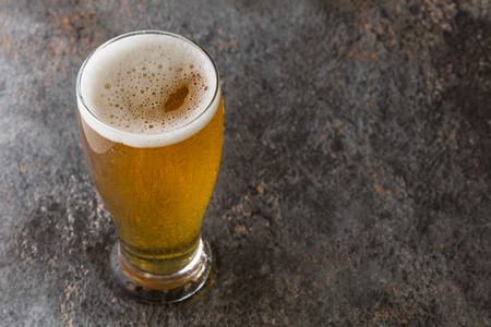 mug with beer on a vintage background