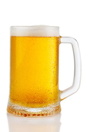 cold mug of beer with foam isolated on white backgroundの写真素材