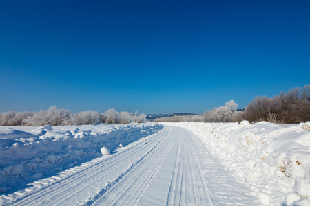 winter landscape with roadの写真素材