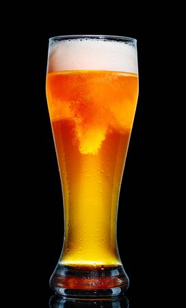 Glass of beer isolated on black background.の写真素材