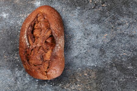 Freshly bread on gray kitchen table. Top view
の写真素材