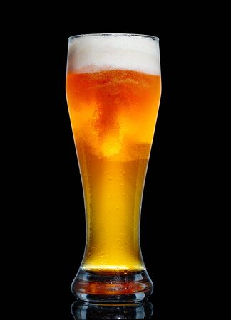 Glass of beer isolated on black background.の写真素材