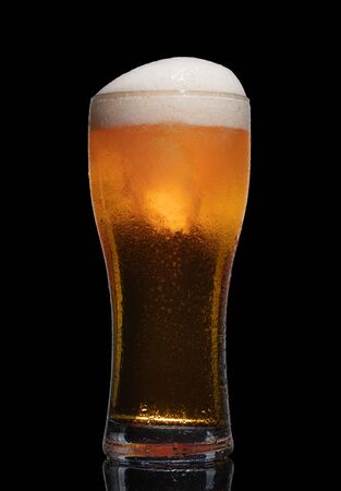 Glass of beer isolated on black background.の写真素材