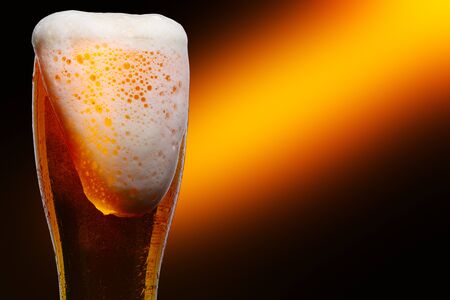 Glass of cold craft light beer on dark background.
の写真素材