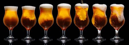 Set of Glasses of Beer Isolated on Black Backgroundの写真素材