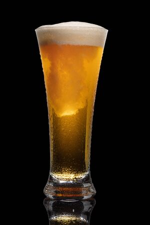 Glass of beer isolated on black background.の写真素材