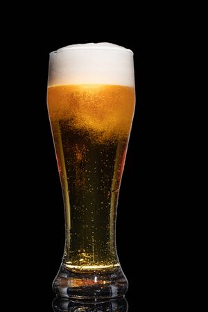 Glass of beer isolated on black background.の写真素材