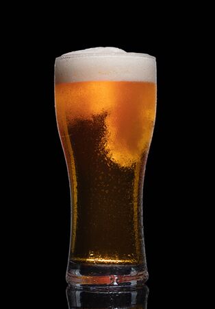 Glass of beer isolated on black background.の写真素材