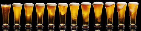 Set of Glasses of Beer Isolated on Black Backgroundの写真素材