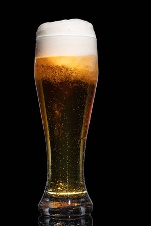 Glass of beer isolated on black background.の写真素材
