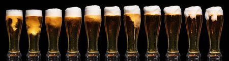 Set of Glasses of Beer Isolated on Black Backgroundの写真素材