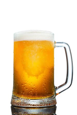cold mug of beer with foam isolated on white backgroundの写真素材