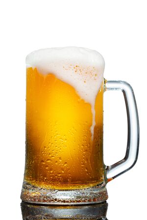 cold mug of beer with foam isolated on white backgroundの写真素材