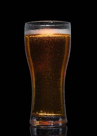 Glass of beer isolated on black background.の写真素材