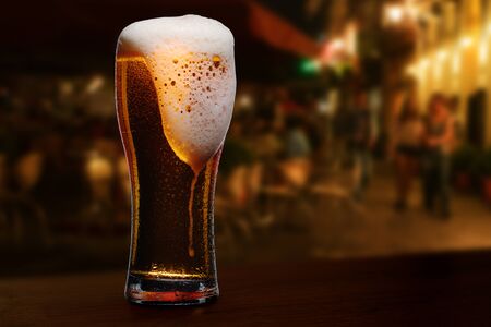 glass of beer on a street bar table
の写真素材