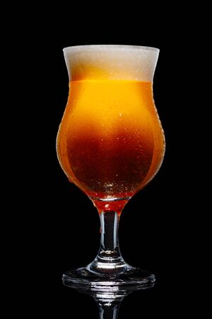 Glass of beer isolated on black background.の写真素材