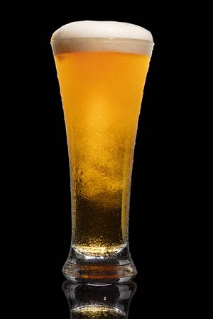 Glass of beer isolated on black background.の写真素材