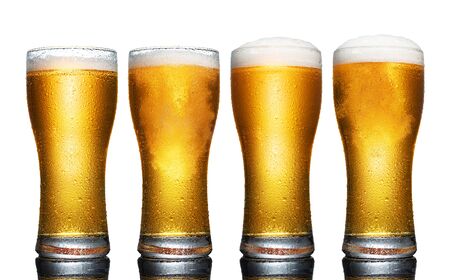 Set of a glass of cold light beer with foam isolated on white backgroundの写真素材