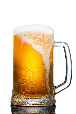 cold mug of beer with foam isolated on white backgroundの写真素材
