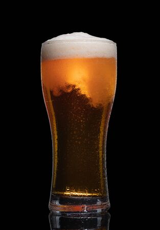 Glass of beer isolated on black background.の写真素材