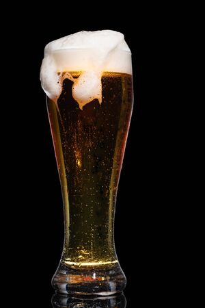 Glass of beer isolated on black background.の写真素材