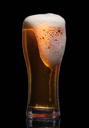 Glass of beer isolated on black background.の写真素材