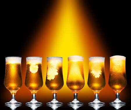 Set Glass of cold craft light beer on dark background.の写真素材