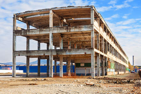 Abandoned factory concrete ruins preparing for new buildingの写真素材