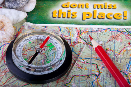 Compass and pencil on the map and guidancesの写真素材