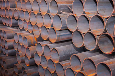 Steel Pipes bunch on the rack in warehouseの写真素材
