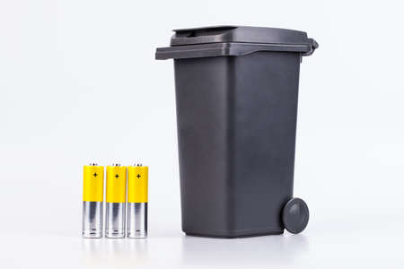 Raw of yellow AA alkaline batteries isolated on white backgroundの写真素材