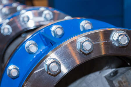 The flanges of valves with bolts and nutsの写真素材