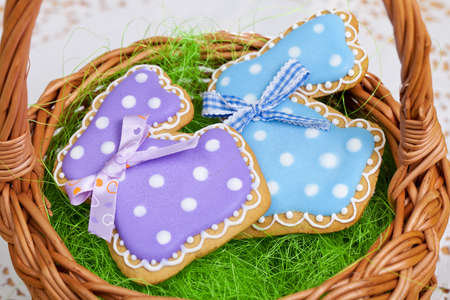 Rabbit and Egg as Easter traditional Gingerbread cookies in basketの写真素材