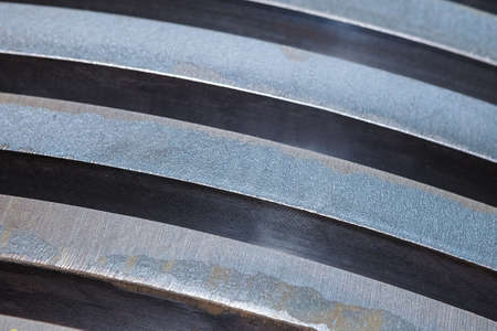 Background of steel plates stacked in warehouse, close upの写真素材