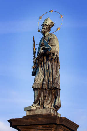 Saint John of Nepomuk on the famous charles bridge in pragueの写真素材
