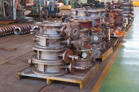 Heap of valve bodies spare parts prapared for mashining in factory. Casting carbon steel boides. Forging stainless still parts. Industrial background from part of valves for power, oil or gas industryの写真素材