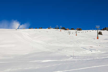 Chairlift without people. The cable car on the blue sky in the Dolomites. Cableway in the mountains without people.の写真素材