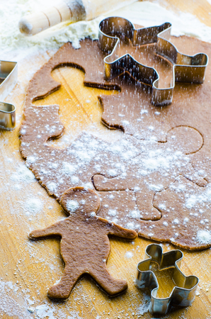 cooking cookies in the form of little people for Christmas
