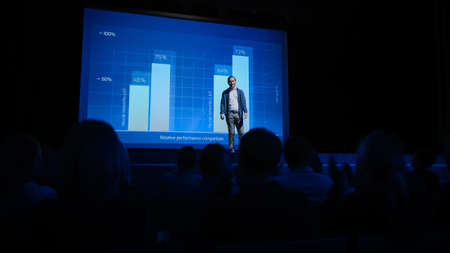 Startup Conference Stage: Speaker Presents New Product, Talks about Performance, Neural Networks, Artificial Intelligence, Big Data and Machine Learning. Live Business Event with Large Audienceの写真素材