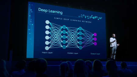 Computer Science Startup Conference: On Stage Speaker Does Presentation of New Product, Talks about...